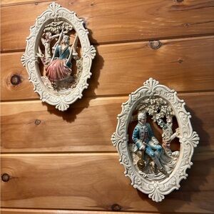 Vintage matching pair of Syroco United wall plaques dated 1962.